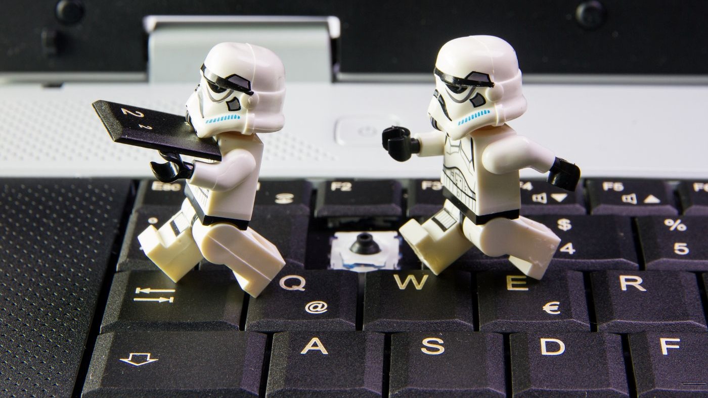 To miniature robots running away with a stolen key from a keyboard
